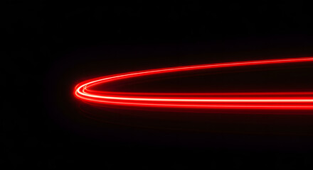 Poster - Red Light Trail: A mesmerizing red light trail streaks gracefully across a stark black background, the vibrant illumination creating a dynamic and captivating visual.