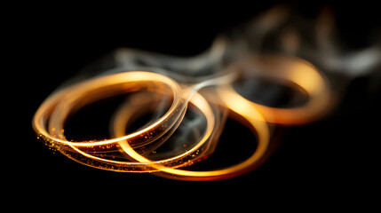 Poster - Golden Rings of Light: Abstract image of intertwining golden rings of light, creating a dynamic and captivating visual. The dark background accentuates the vibrant glow of the rings.