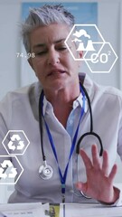 Poster - Animation of eco icons and data processing over caucasian female doctor