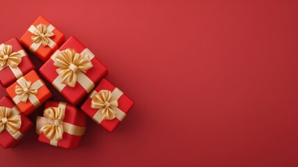 Poster - Top view of multiple small gift boxes with red and gold wrapping arranged in a corner on a red background with lots of copy space