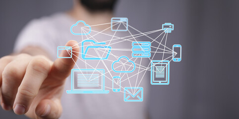 Poster - Man interacts with a digital network of connected devices, illustrating cloud computing and data sharing.