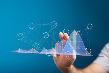 Poster - Stock photo of a hand interacting with a digital graph, showing data analysis and growth trends.