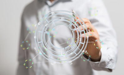 Poster - A businessman interacts with a holographic data visualization, analyzing business performance and key metrics.