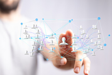 Poster - Stock photo of a hand interacting with a 3D network visualization representing connections between people.