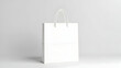 © Fizzah - Eco-friendly paper bag isolated on clean neutral surface