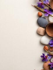 Poster - A serene arrangement of pebbles, nuts, and purple flowers on a soft background, suggesting tranquility
