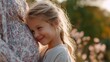 © fotofabrika - Young girl smiles joyfully while embracing her mother's pregnancy in a sunlit park during the golden hour