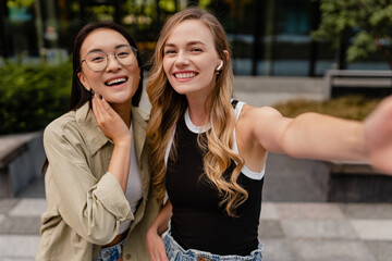 two young pretty women students in street