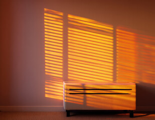 Aufkleber - Soft sunlight casts striped window shadows on minimalist beige cabinet against clean wall, creating warm, tranquil atmosphere in modern interior space