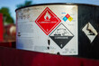 © Nattawit - Acidity corrosion or skin burn hazard, safety sign on the chemical containment barrel. Sign and symbol for industrial product, close-up.