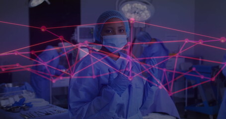 Poster - In hospital, medical professionals performing surgery with digital image overlay