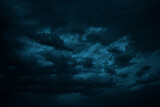 Dramatic sky with clouds. Black dark blue green night sky. Thunderstorm storm. Ominous, frightening.