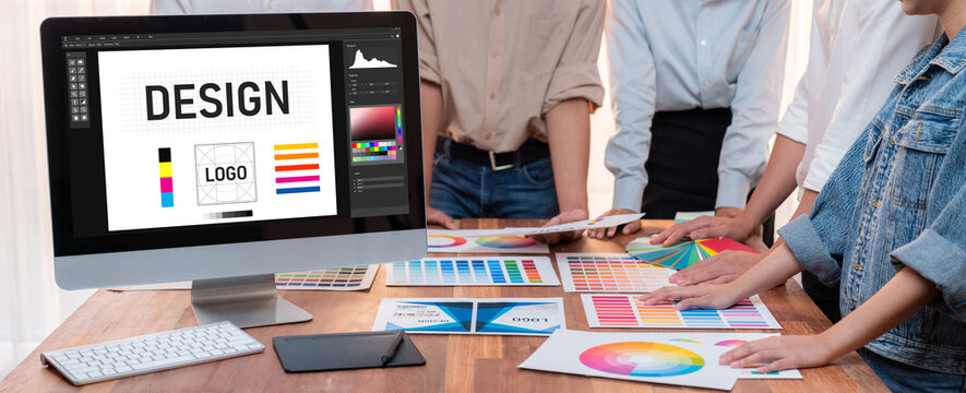 Graphic designer software for modern design of web page and commercial brisk ads showing on the computer screen