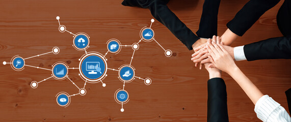 Poster - This image showcases teamwork and collaboration in a business setting, featuring hands joining together on a table alongside infographic elements illustrating data analysis. Amity
