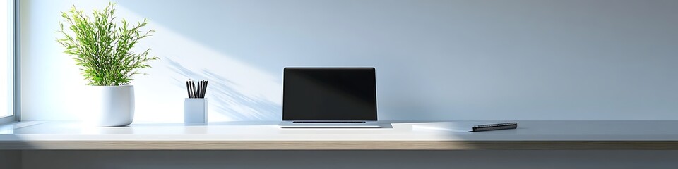Poster -  A modern workspace with a focus on a sleek laptop and notepad