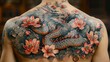 © NuriAlam - Back tattoo dragon amidst cherry blossoms and clouds. Detailed, full-back coverage