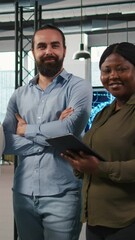 Poster - Vertical video Portrait of happy teamworking engineers writing code, developing machine learning APIs. Team of smiling IT experts troubleshooting software errors using artificial intelligence, camera