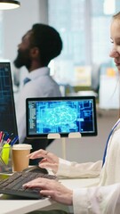 Fototapete - Vertical video IT expert in high tech startup office uses neural networks to develop artificial intelligence models. Female engineer uses AI to run tasks across devices, monitoring progress on screens