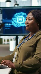 Poster - Vertical video Female admin using AI neural networks tech on computer to optimize performance and forecast issues. Woman in office training artificial intelligence deep learning models using PC