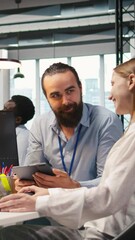 Fototapete - Vertical video Mentor teaching young employee to troubleshoot software errors using AI. Manager doing induction to newcomer junior dev using computer to write code, developing machine learning APIs