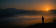 © sam - Silhouette of Person Contemplating Sunrise Over Misty Mountains
