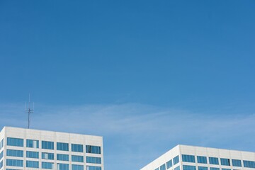 Poster - View of office buildings against blue sky