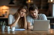© Riya Kanu - Mature couple looking at financial documents and data on a laptop, concerned about money problems and financial stress, Generative AI
