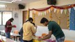 © N7 - Indian college friends decorating classroom for cultural event