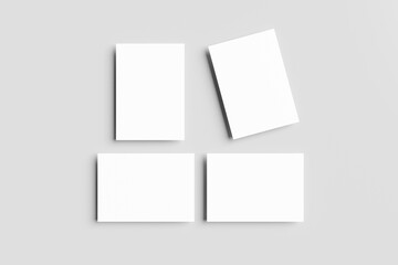 Poster - A4, A3, A5 paper 3D mockups or blank white business cards neatly arranged (horizontally & vertically) isolated on a grey background. Clean and minimalist, for branding or design presentations