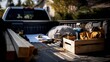 © AspctStyle - Pickup truck bed loaded with lumber, construction blueprints, tools, and a wooden crate containing a drill, gloves, and safety gear, ready for a home improvement or renovation project on a sunny day