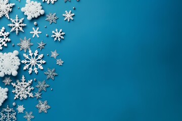 Poster - Festive christmas snowflakes arranged on a vibrant blue background, creating a winter holiday theme