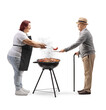 © Ljupco Smokovski - Woman grilling meat and giving a sausage to a senior