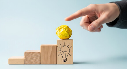 Poster - Wooden blocks forming stairs, culminating in a yellow crumpled paper ball, symbolizing idea achievement, progress, and innovation