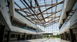 © shirina design - Modern atrium with expansive glass ceiling and wooden support structure