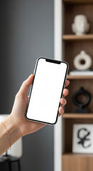 Aufkleber - Hand holding smartphone with blank screen, showcased against blurred interior background. Mockup for app display, website or advertisement. Free space for text
