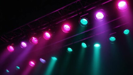 Poster - Chromatic Spectacle: An array of vibrant stage lights, casting a kaleidoscope of hues across the darkness. The interplay of color creates an atmosphere of anticipation.