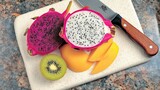 Kitchen counter, dragon fruit sliced, mango, kiwi, knife
