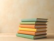 © Auman_Art - several stacks of books neatly arranged on the table