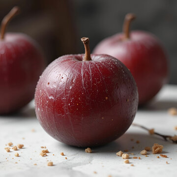 Close-up of a red dried plum without its seed, showcasing its wrinkled texture, rich color.