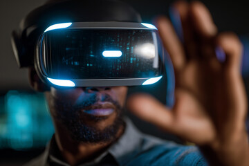 Poster - A man wearing a virtual reality headset is pointing at something