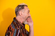 © deagreez - Charismatic bearded gentleman in colorful shirt shouting with excitement against a vibrant yellow background expressing happiness