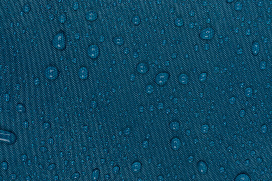 water drops on the blue fabric, horizontal