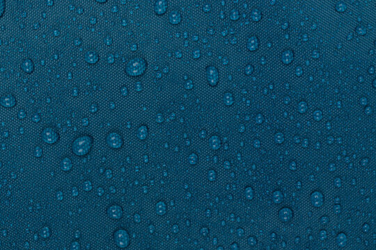 water drops on the blue fabric, horizontal