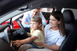 © New Africa - Happy family sitting inside new car. Luxury vehicle