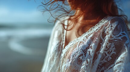 soft-focus shot of lace beach cover-up blowing in wind