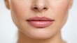 © ng-TDRD - Close-up of a woman's lips, showcasing natural beauty and subtle makeup against a soft, blurred background.