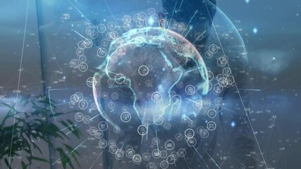 Poster - Man typing tech commands on laptop, activating rotating holographic globe with pulsing data icons