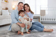 © New Africa - Cute little boy and his parents at home. Lovely family