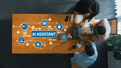Poster - A top-down view of a collaborative workspace showcasing professionals engaged with AI technology tools, including robotics and chatbots, fostering innovation and creativity. Amity