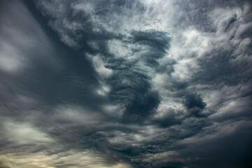 Wall Mural - Dramatic sky with dark clouds before rain and thunderstorm. Natural cloudy sky background. Scary Cloudscape